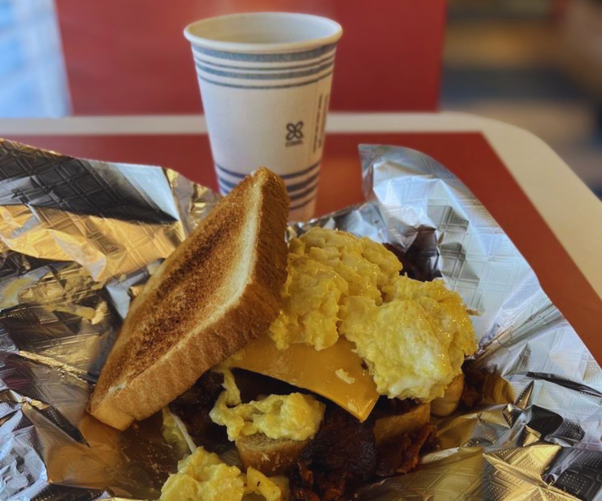 Greg's Breakfast Bar Bacon Sandwich and cup of Coffee