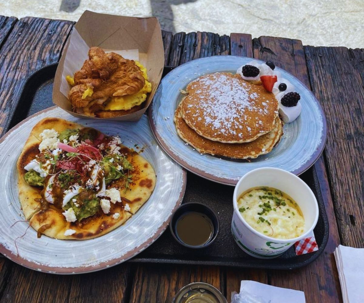 Breakfast AF Avocado Naan, Ham and Egg Croissant, Cornmeal Pancakes, Grits