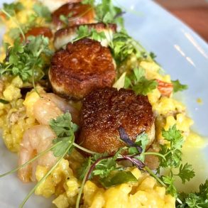 Seared Sea Scallops with Saffron Calasparra Rice at Revival Kitchen & Bar in Concord, New Hampshire