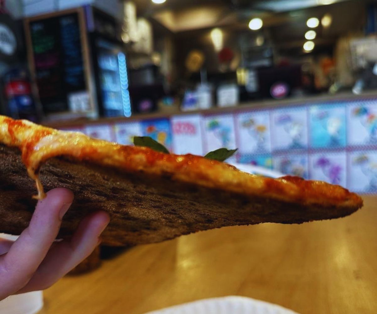 Zee’s Pizzeria - Pizza Slice Close-Up