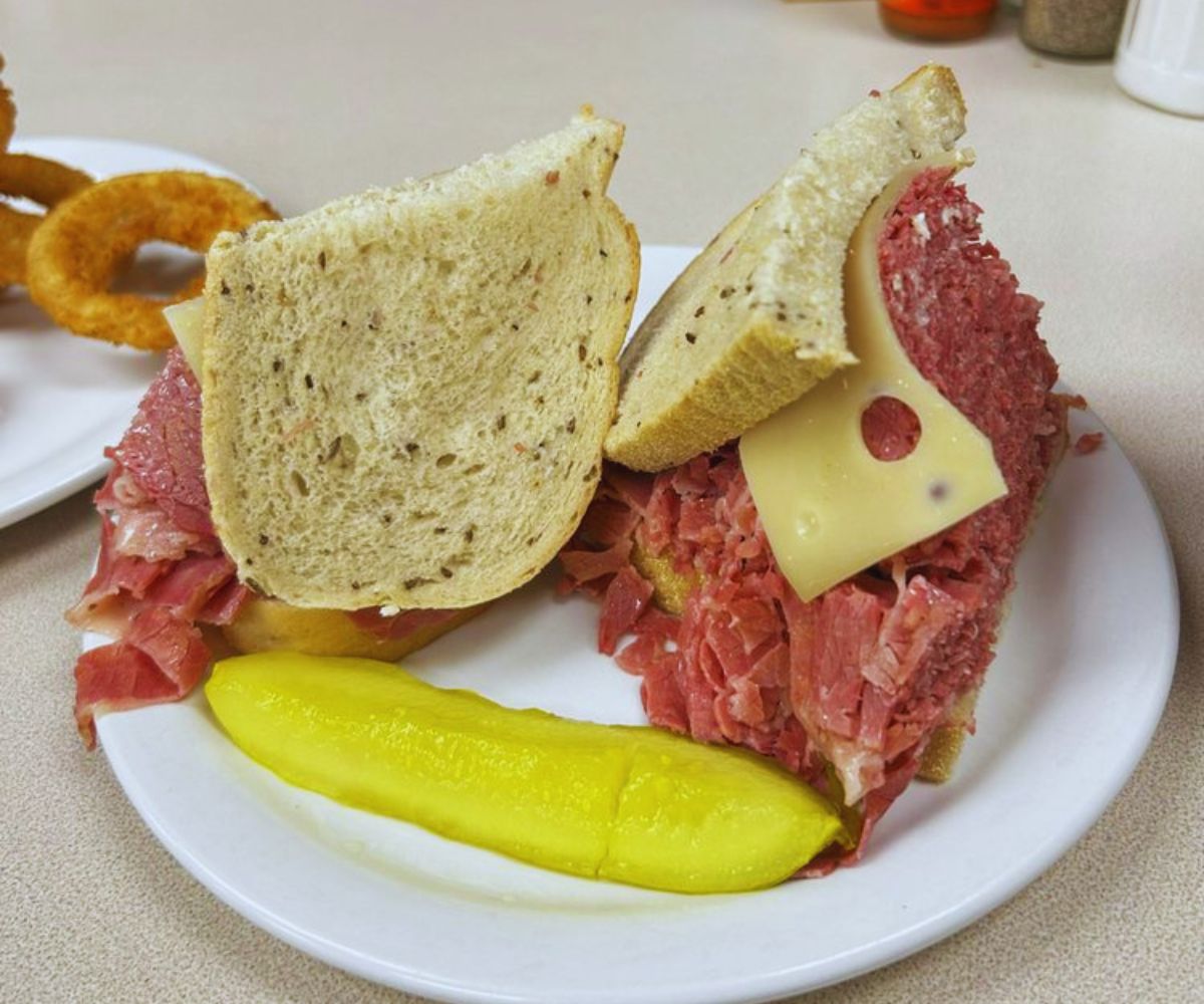 Slyman's Restaurant - Corned Beef Sandwich with Cheese & Pickle