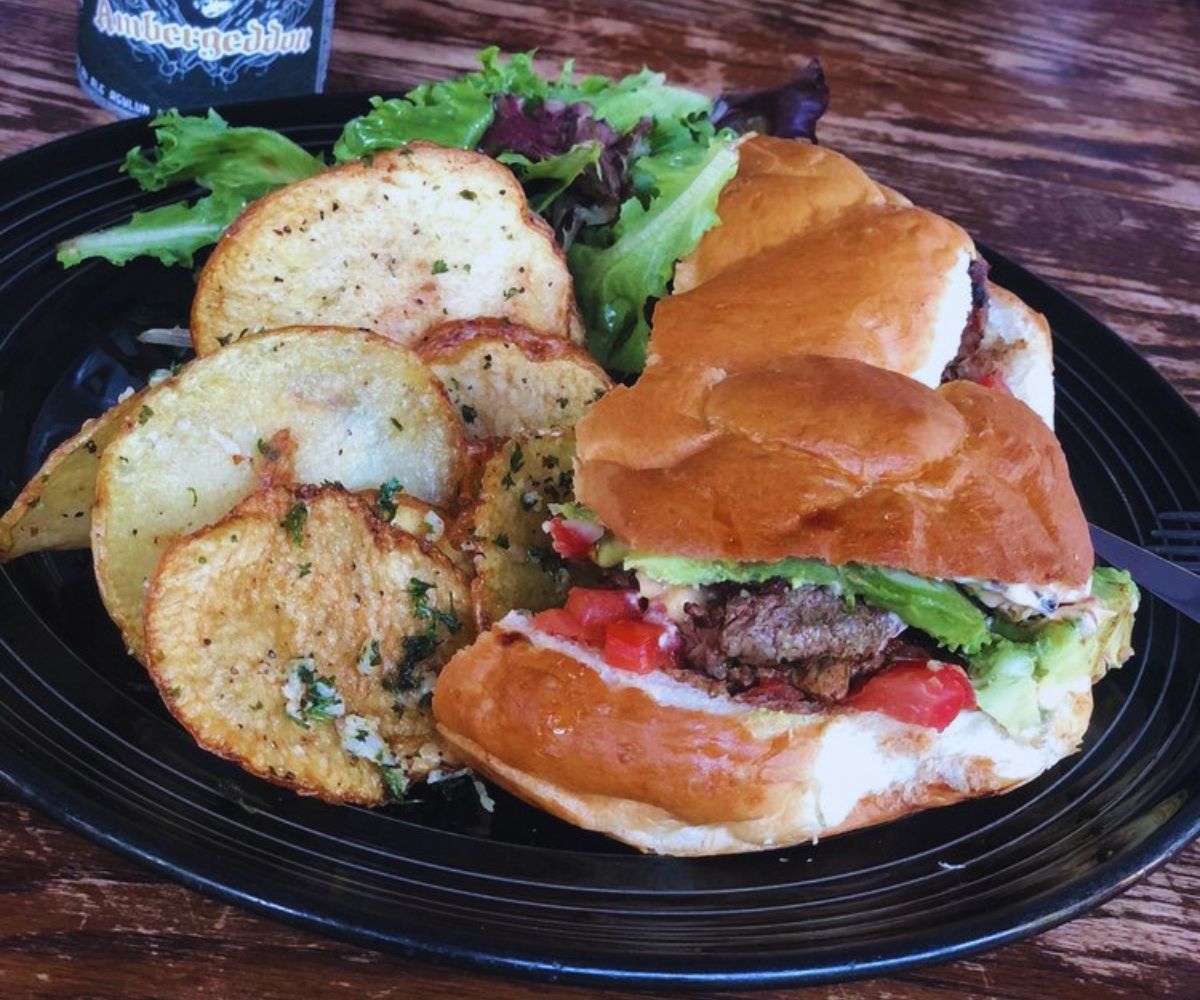 The Weary Traveler Freehouse - West of the Andes Sandwich with Beef Tenderloin and a side of Mixed Greens & Garlic Potatoes