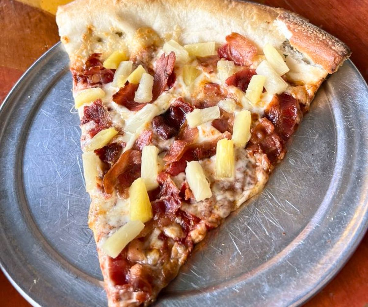 bacon and pineapple pizza at Satchel's Pizza in Gainesville, FL