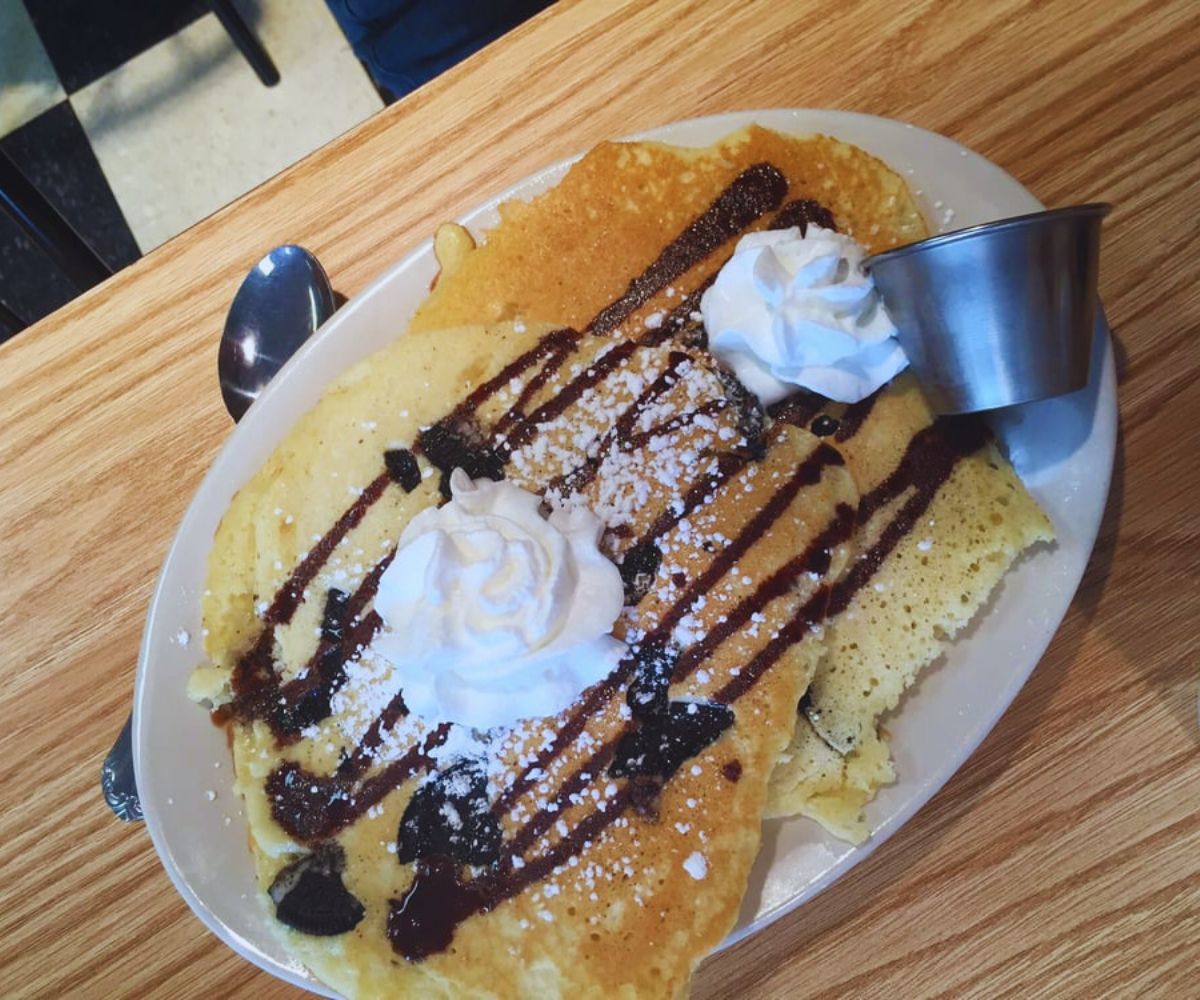 Nzinga's Kitchen - Pancakes with Chocolate Syrup & Whipped Cream