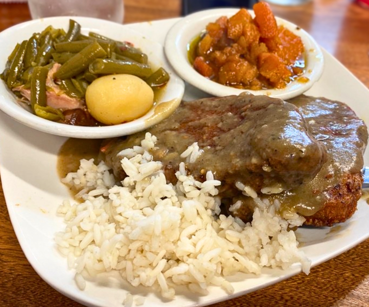 Smothered Pork Chop at Shugs Comfort Food in Bellevue, NE