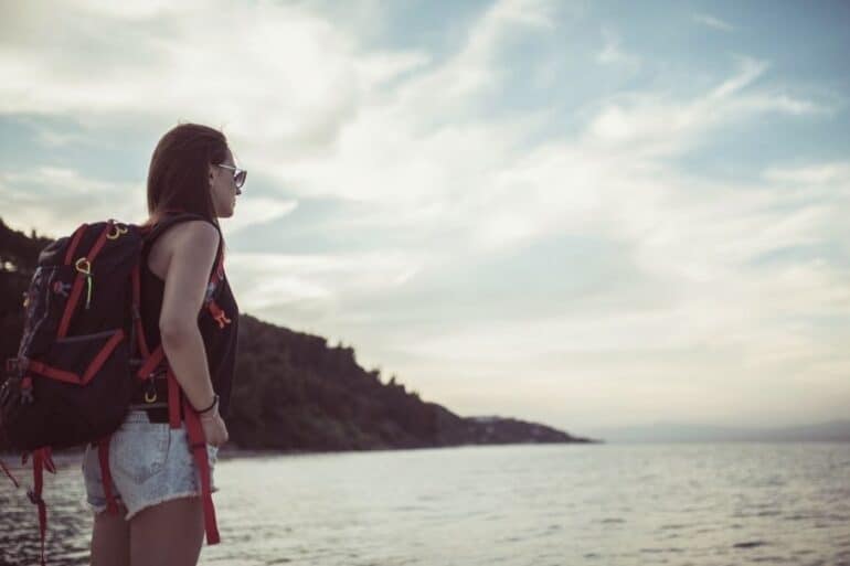 first time traveler staring into ocean