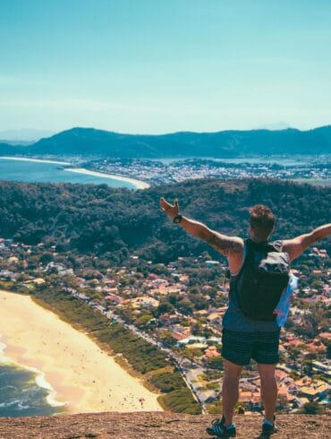 a traveler overlooking the city and the beach