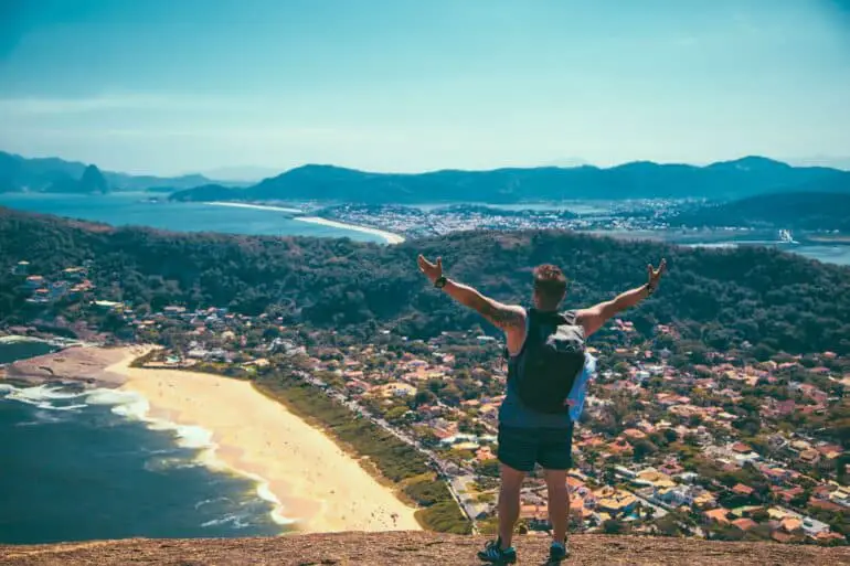 a traveler overlooking the city and the beach