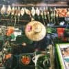 overhead view of a vendor grilling food