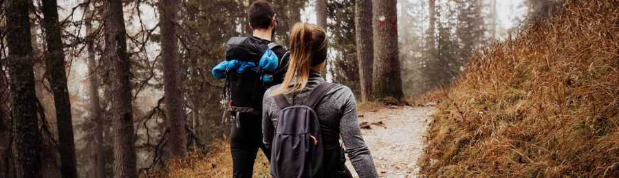couple hiking on a trail, romantic vacation ideas for couples