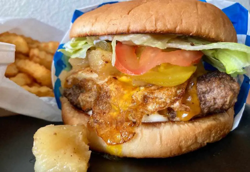 a huge burger at Mel's Blueplate Express in Galveston, Texas