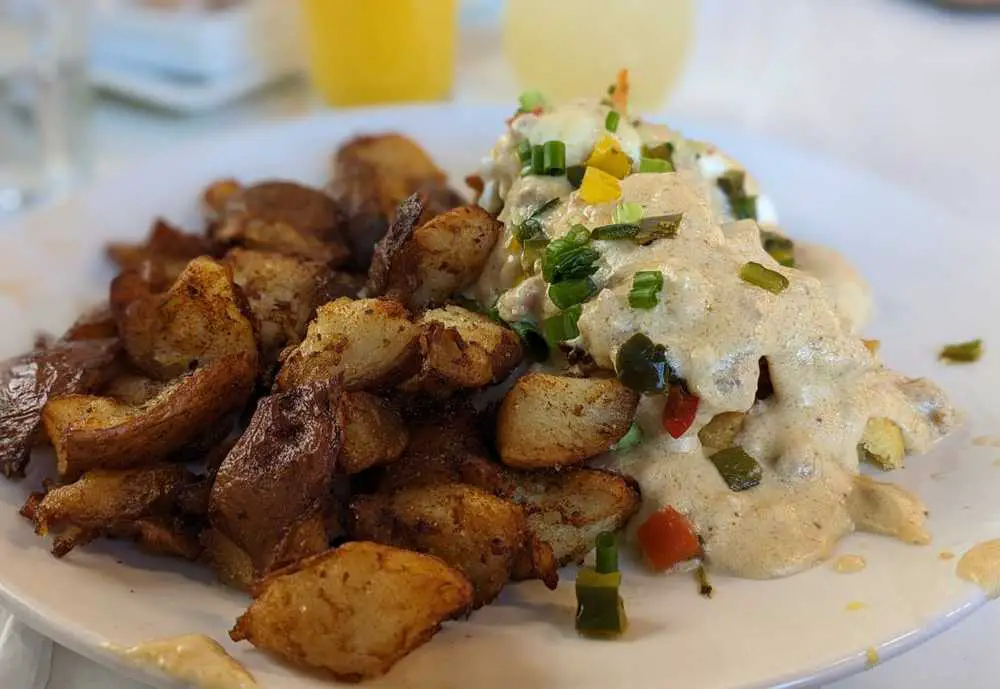 Chicken fried chicken benedict  at Four Friends kitchen in Denver Colorado