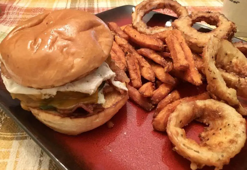Vertigo Burger with onion rings and fries at Vertigo Burger in Tallahassee, FL