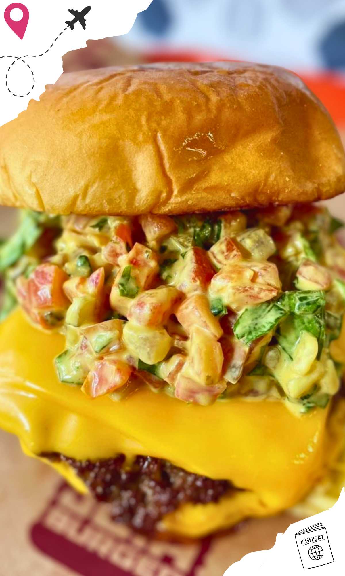 Close-up of a Single Patty Wagyu Burger, slightly opened to reveal the chopped vegetables and sauce on top.