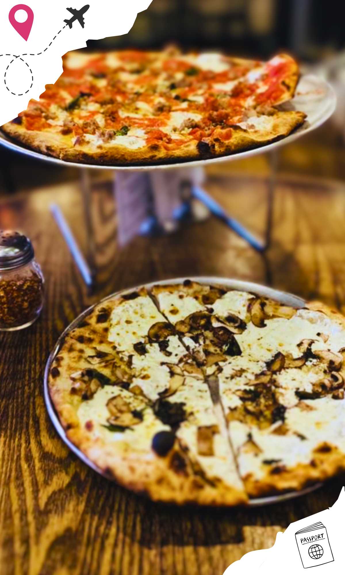 Personal white pie on the wooden table with the medium Margherita elevated with a silver holder.