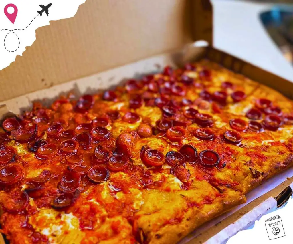 Two square pepperoni pizzas in the same box.