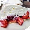 Sweet strawberry shortcake with fresh berries and whipped cream, perfect for travel or vacation treats. Ideal for travelers seeking delicious desserts in popular destinations.