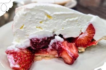 Sweet strawberry shortcake with fresh berries and whipped cream, perfect for travel or vacation treats. Ideal for travelers seeking delicious desserts in popular destinations.