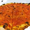 A pizza with just tomato sauce.