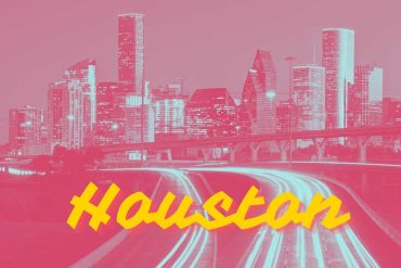 Vibrant pink-tinted skyline of Houston with illuminated highways and modern skyscrapers, showcasing the city's dynamic urban landscape and fast-paced lifestyle. Perfect for travel and destination-focused content.