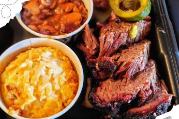 Juicy BBQ ribs served with cheesy mashed potatoes and baked beans, perfect for a tasty meal while exploring top travel destinations.