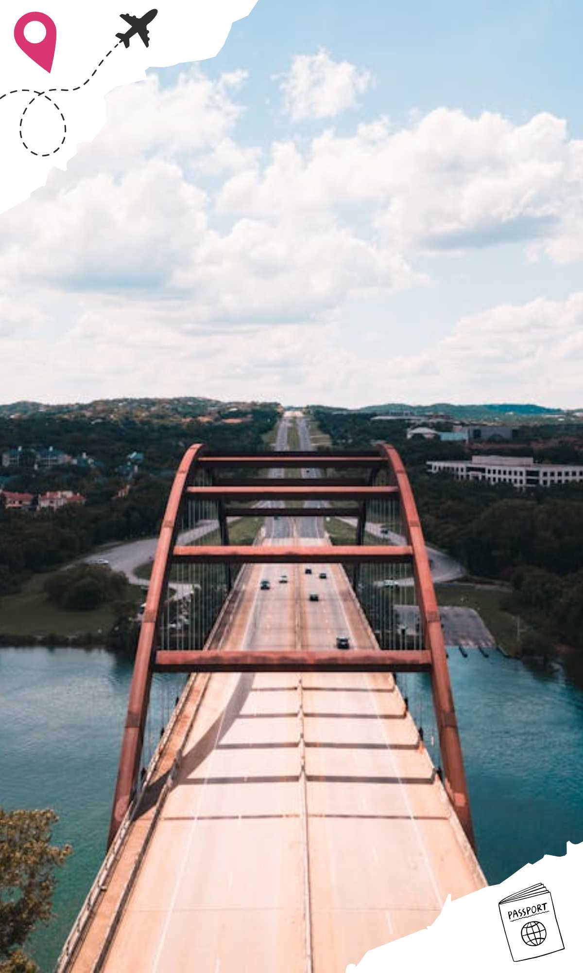 Front view of a large red bridge on a highway over a body of water.