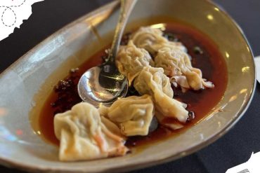 Fresh ravioli with spicy chili oil in an elegant bowl, showcasing delicious Italian cuisine perfect for travel food experiences.