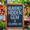 Heavenly hidden gem sign in Columbia, Missouri, outdoor restaurant scene with people dining, lush greenery, and cozy ambiance, perfect for travel and food enthusiasts exploring Columbia.