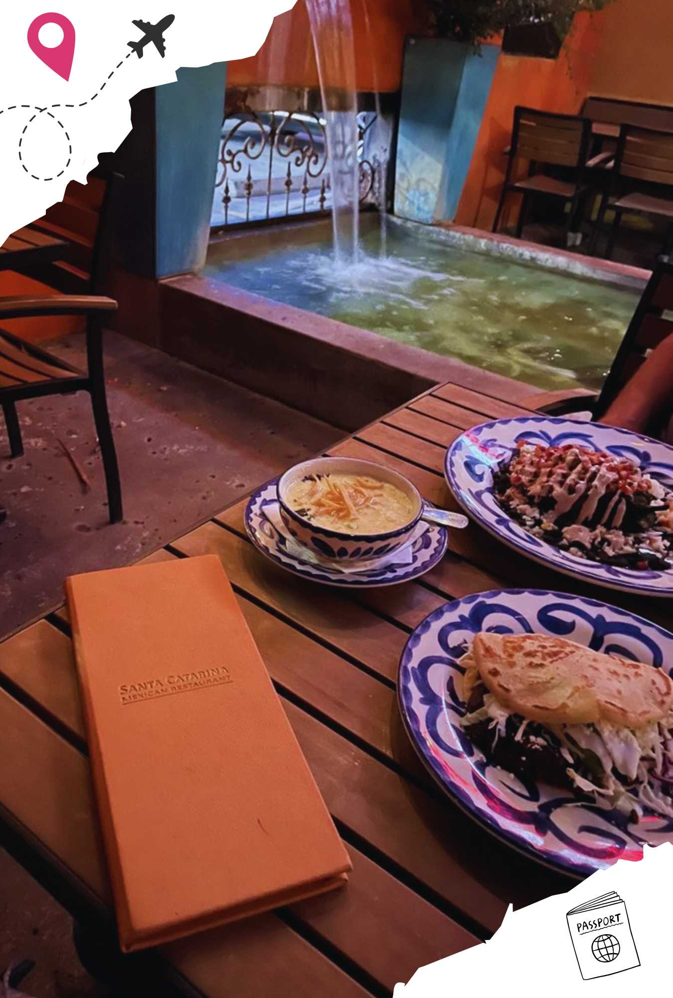 Gordita with venison chorizo, crema elote soup, and En Nogado poblano on a wooden table in front of a fountain.