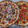 Freshly baked gourmet pizzas topped with assorted meats, vegetables, and melted cheese, perfect for a delicious dine-in experience. Ideal for pizza lovers seeking flavorful and satisfying fast casual meals.