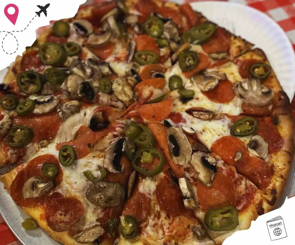 Savory pepperoni mushroom green pepper pizza on a white plate.
