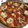 A delicious Margherita pizza with fresh basil, mozzarella, and tomato sauce on a crispy crust, perfect for travel food lovers and culinary explorers.