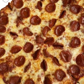 Cheesy pepperoni pizza with crispy crust, close-up view, ideal for pizza lovers and fast food enthusiasts.