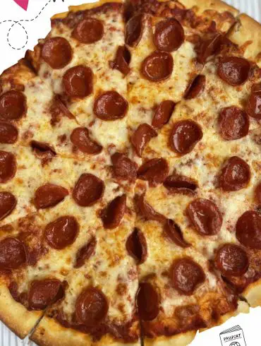Cheesy pepperoni pizza with crispy crust, close-up view, ideal for pizza lovers and fast food enthusiasts.