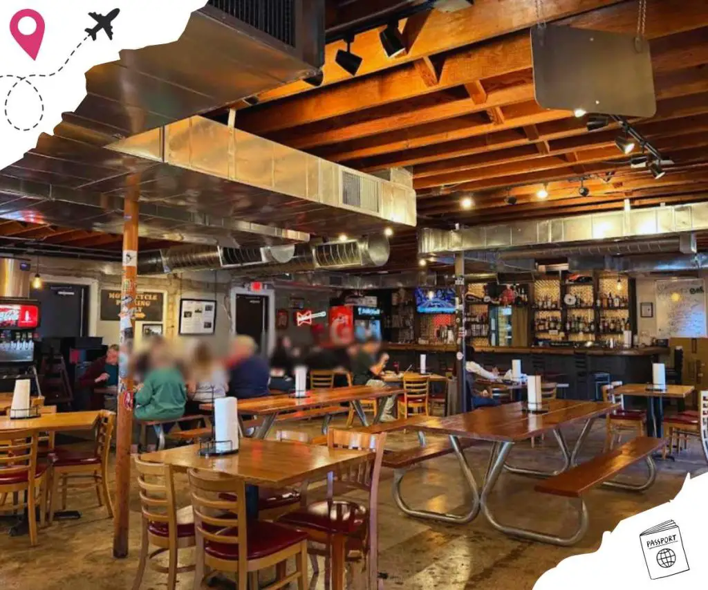 Cozy brewery interior with wooden tables and industrial accents for travelers exploring new destinations.