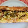 Savory taco filled with ground beef and chopped lettuce on a soft bun, perfect for authentic Mexican street food or casual dining experiences.