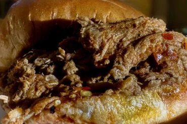 Savory meat-filled bread bowl with shredded beef filling and crispy crust, ideal for comfort food cravings, traditional recipes, and delicious hearty meals.