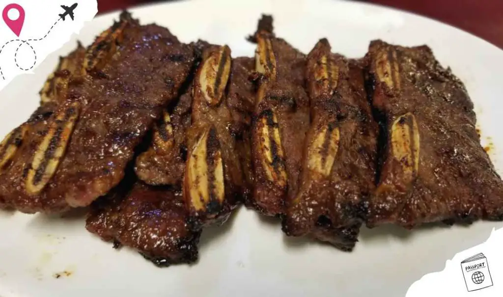 Succulent grilled short ribs with banana peppers for a flavorful beef dish.