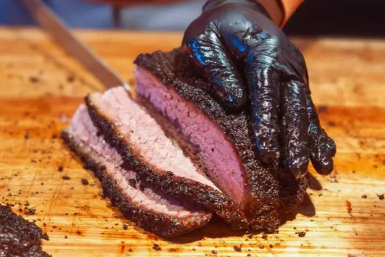 slicing juicy brisket at back home bbq in little rock arkansas