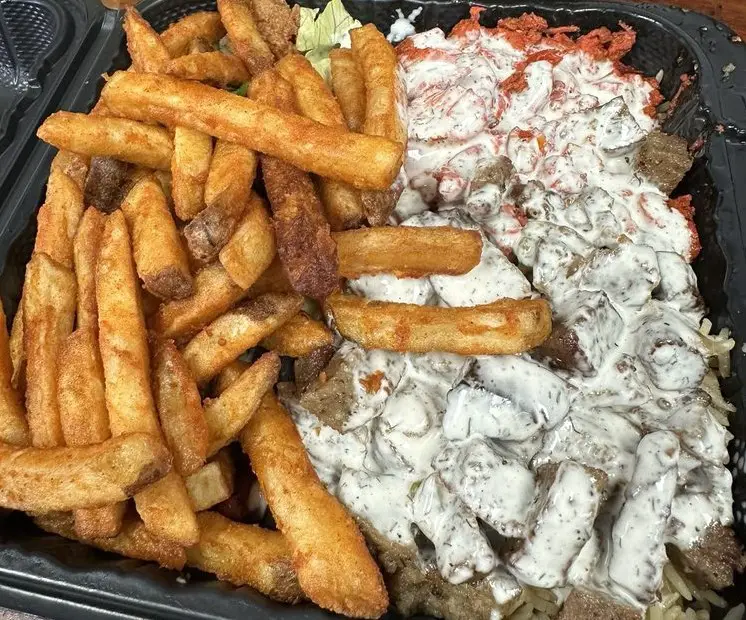 Chicken & lamb over rice plate at Crispy Halal located in Allentown, Pennsylvania.