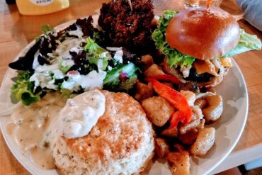 Cobb salad, fried chicken and waffle, wg burger, potatoes, biscuit and gravy in Lovely Day Cafe located in Bedford, TX.