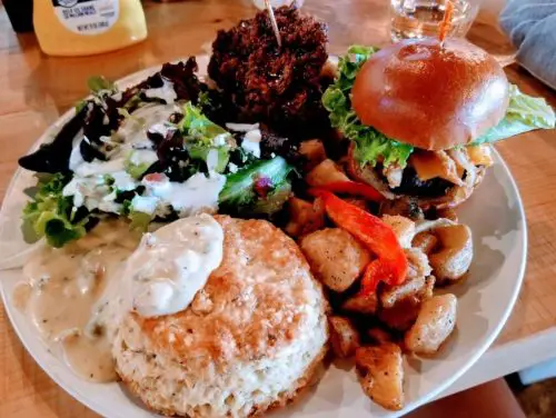 Cobb salad, fried chicken and waffle, wg burger, potatoes, biscuit and gravy in Lovely Day Cafe located in Bedford, TX.