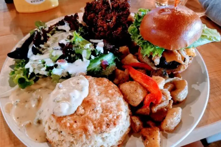 Cobb salad, fried chicken and waffle, wg burger, potatoes, biscuit and gravy in Lovely Day Cafe located in Bedford, TX.