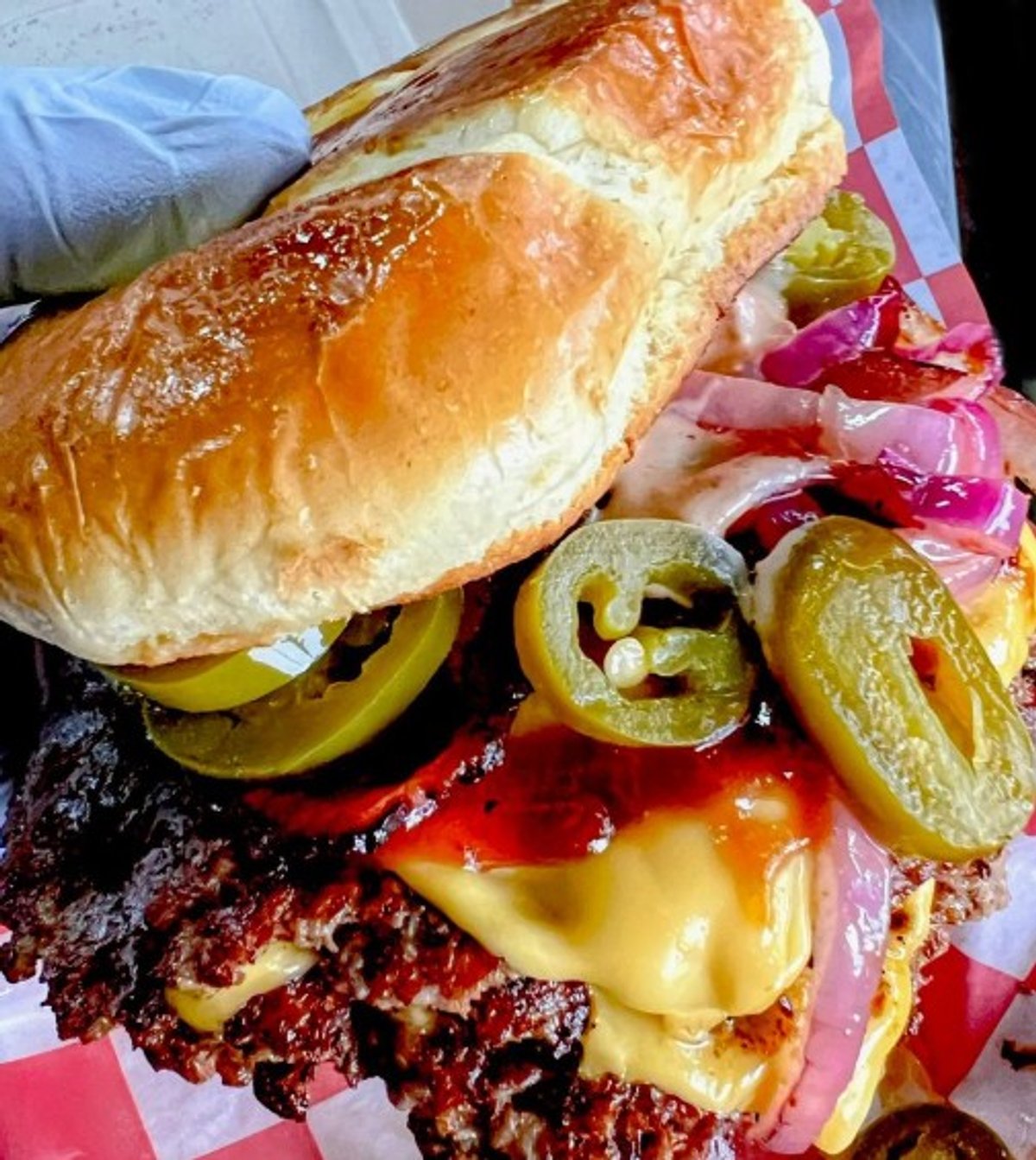 Double smash with grilled onion and jalapeños in Cleave Land Grill located in Strongsville, OH.