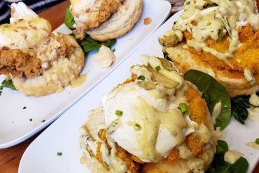 Nashville hot catfish benedict and the chicken st charles benedict at Ruby Slipper Mobile located in Mobile, AL