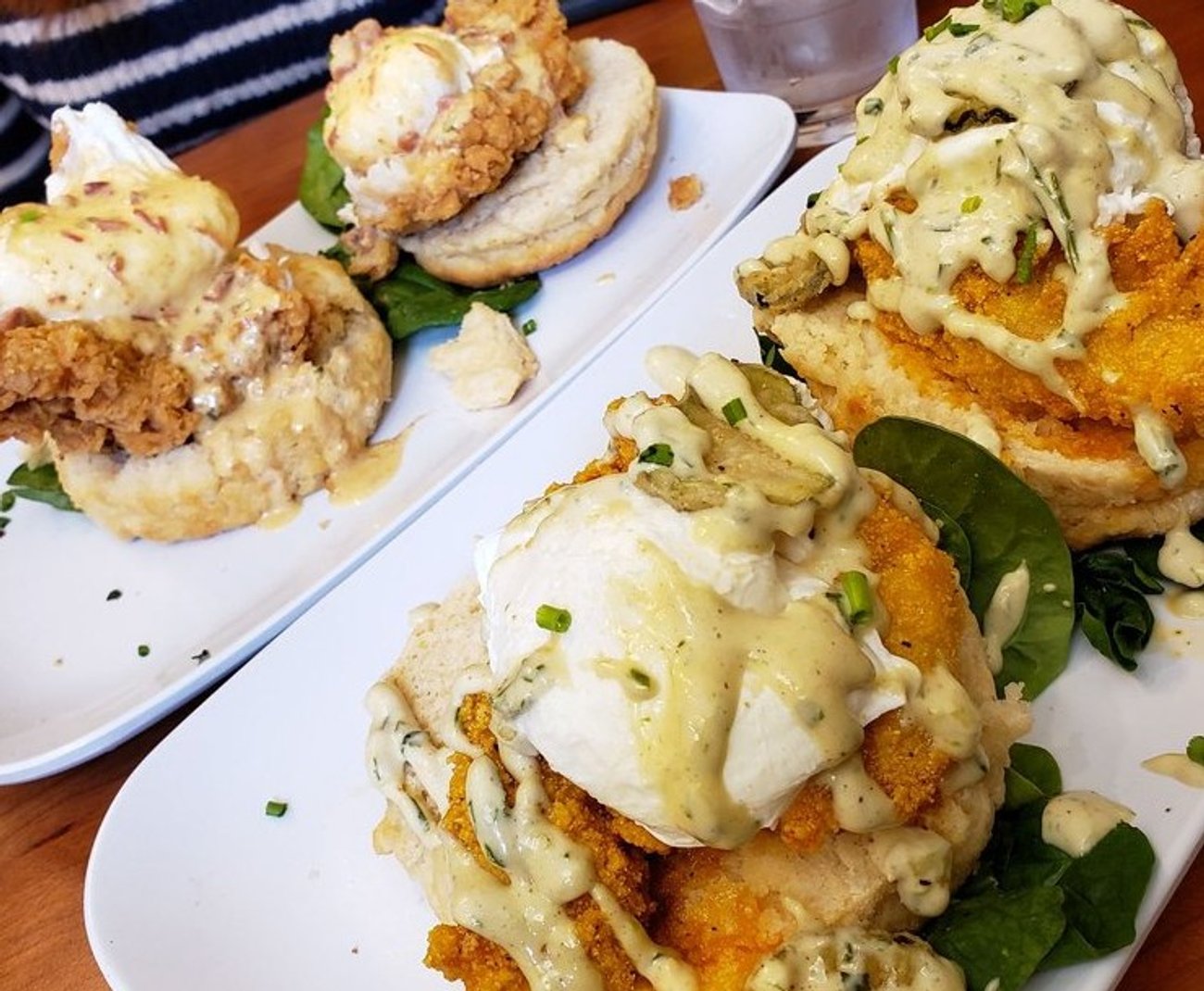 Nashville hot catfish benedict and the chicken st charles benedict at Ruby Slipper Mobile located in Mobile, AL