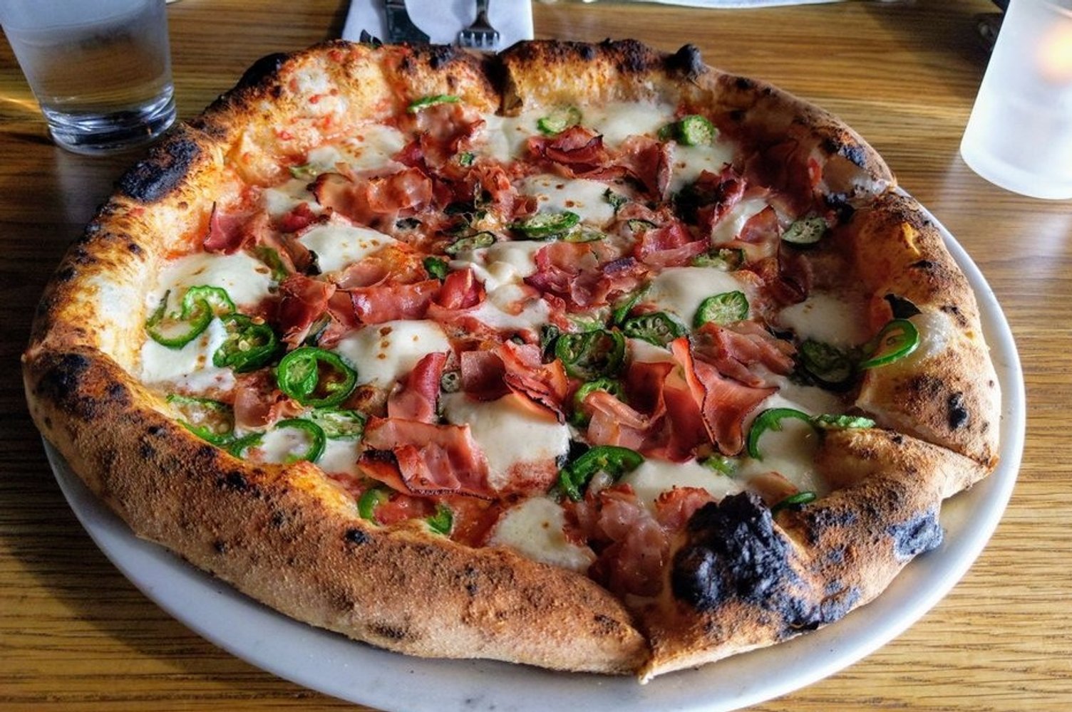 Pink pizza special with okra, jalapenos, and (iirc)soppressata at A Dopo Sourdough Pizza located in Knoxville, TN.
