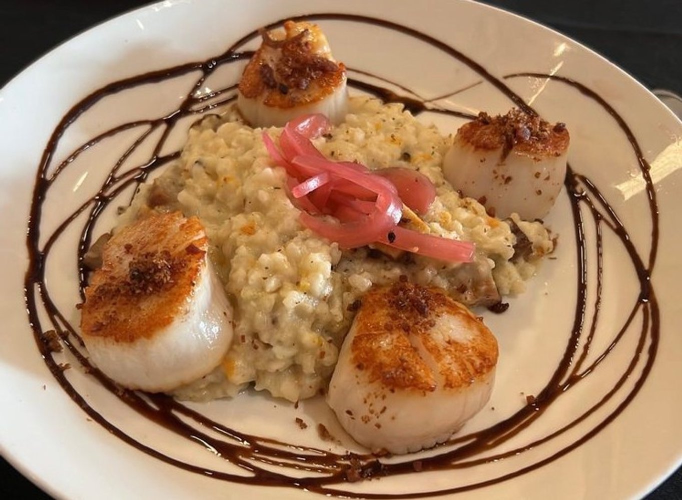 Scallop risotto at EnVie located in Lansing, MI.