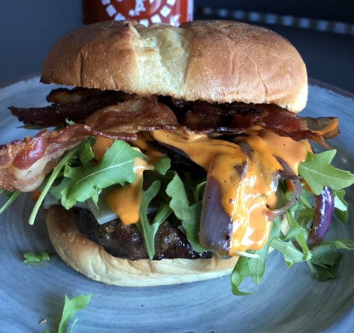 Sriracha burger in Asadoras Argentinas Burgers located in Oswego, IL.