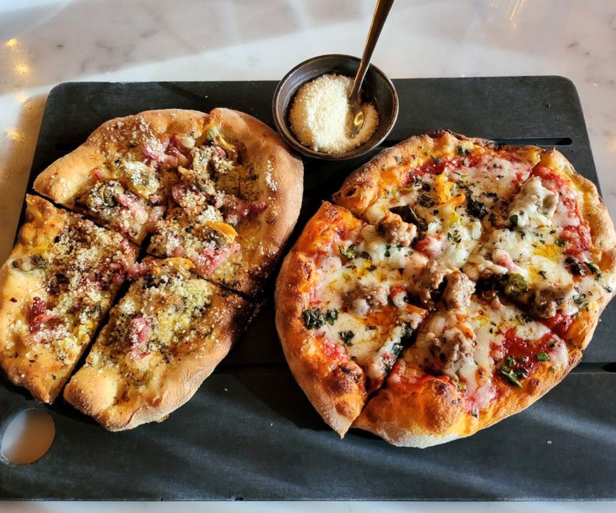 Penn Cove Clams and Sweet Fennel Sausage pizzas at Serious Pie in Seattle, WA